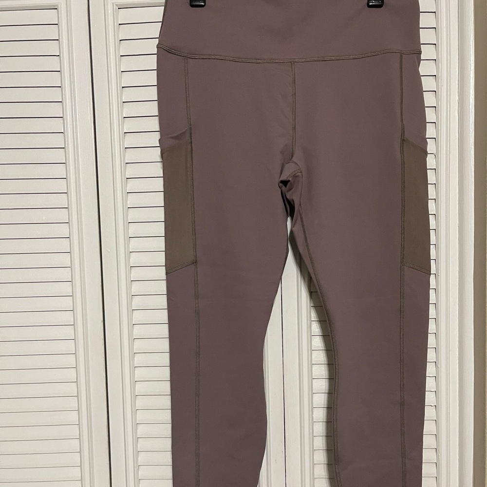 Fabletics tan Powerhold legging with outside mesh pockets